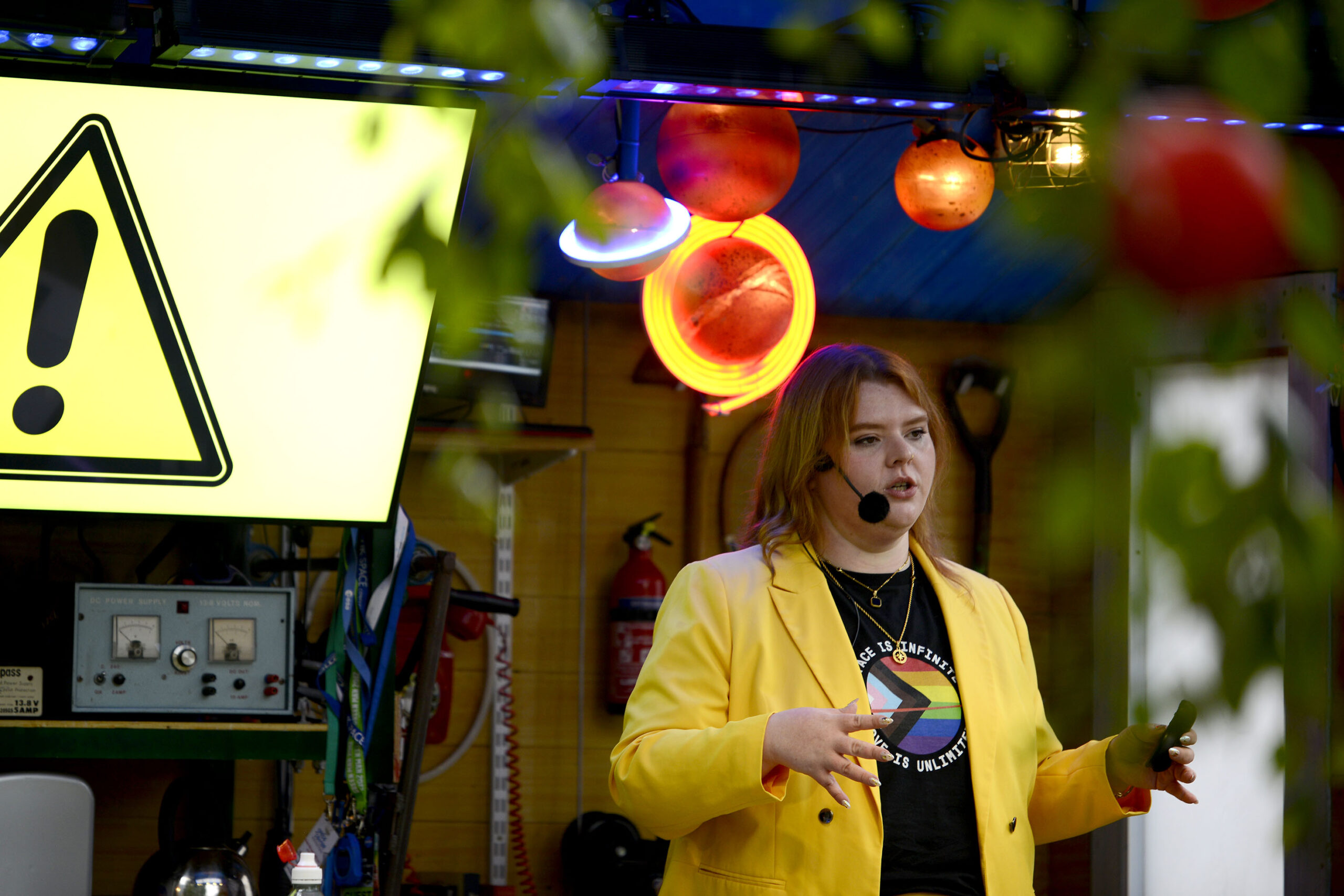 A red haired human is telling a story outdoors